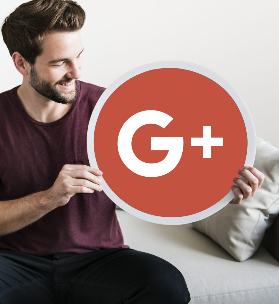 person holding google plus icon